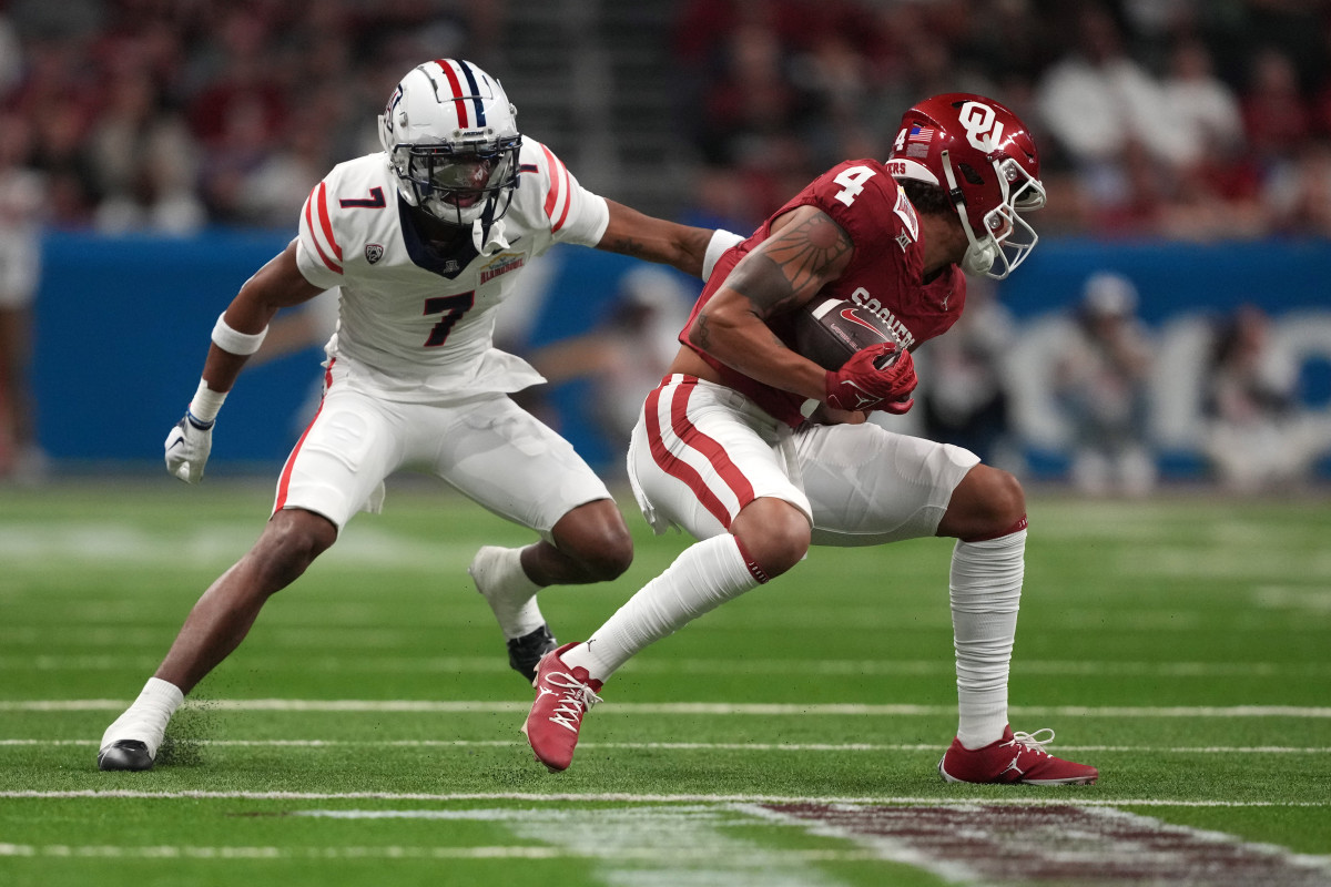 Dec 28, 2023; San Antonio, TX, USA; Oklahoma Sooners wide receiver Nic Anderson (4) catches the ball against Arizona Wildcats cornerback Ephesians Prysock (7) in the fist half of the Alamo Bowl at Alamodome. Mandatory Credit: Kirby Lee-USA TODAY Sports